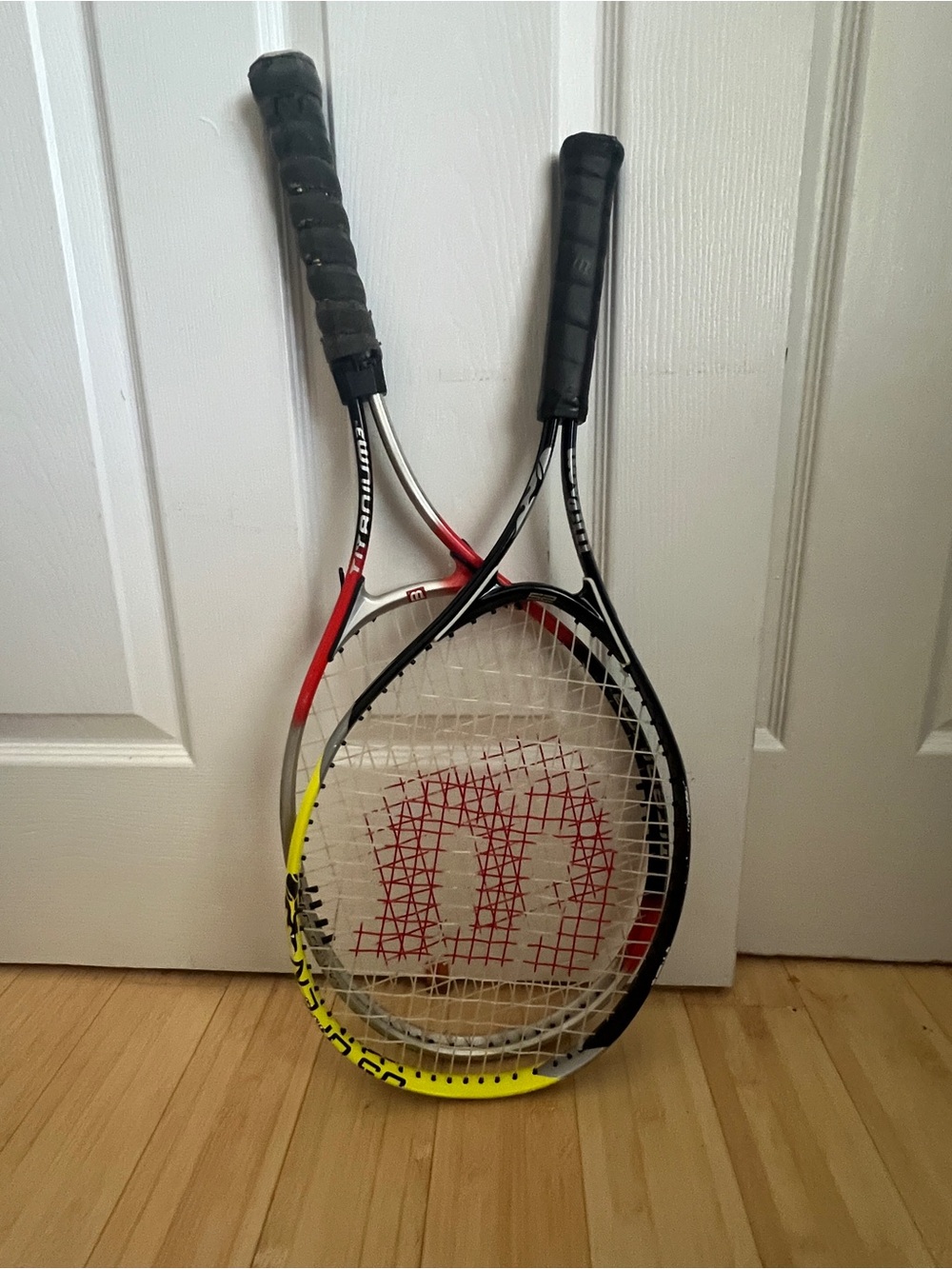 Wilson Tennis Racquets with Red Logo and Black and Yellow Accents